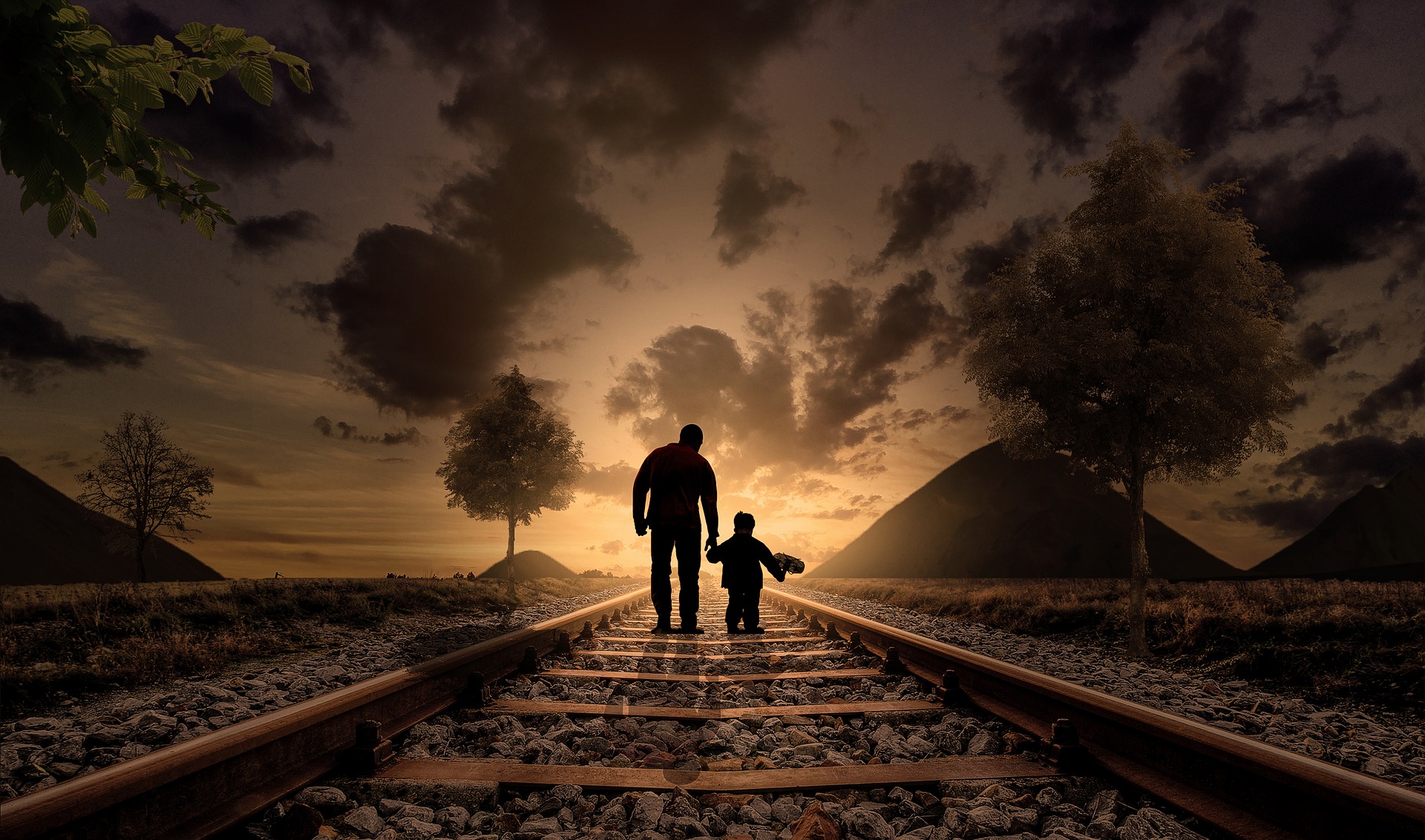 Father and son walking on the railway