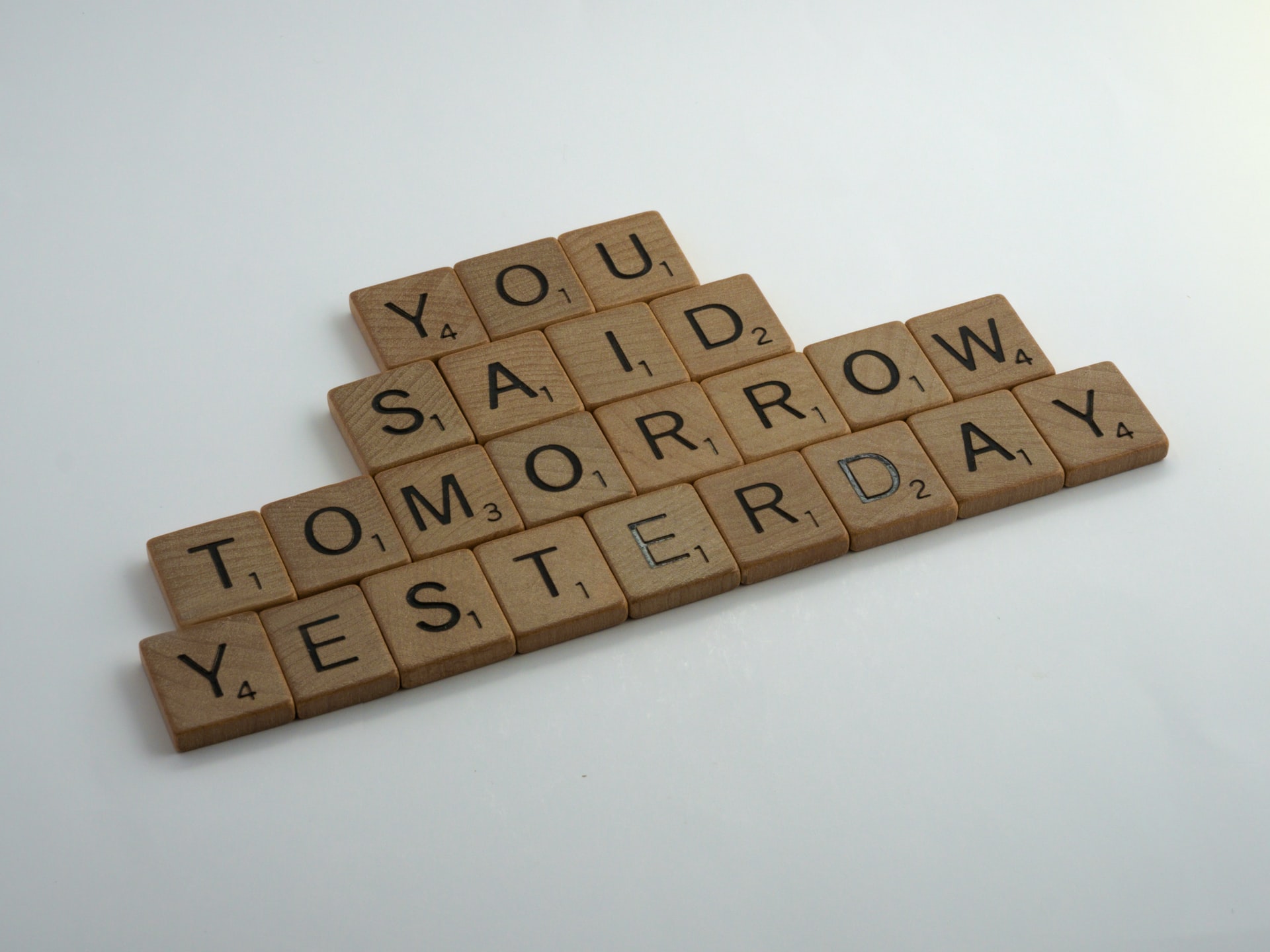 Scrabble tiles that reads - you said tomorrow yesterday