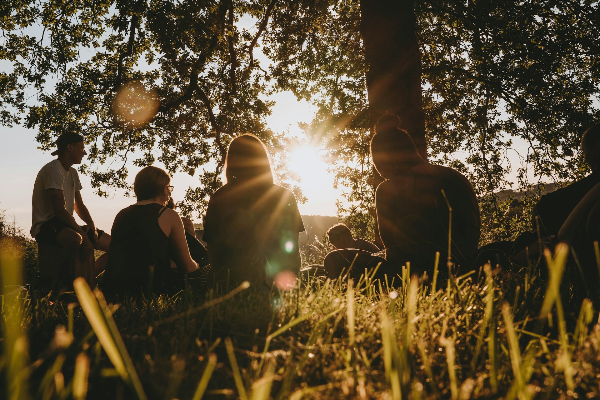 people sitting in a circle in nature retreat
